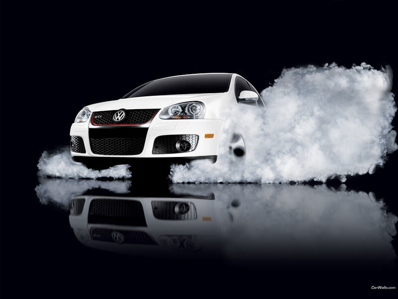 White Volkswagen GTI with smoke