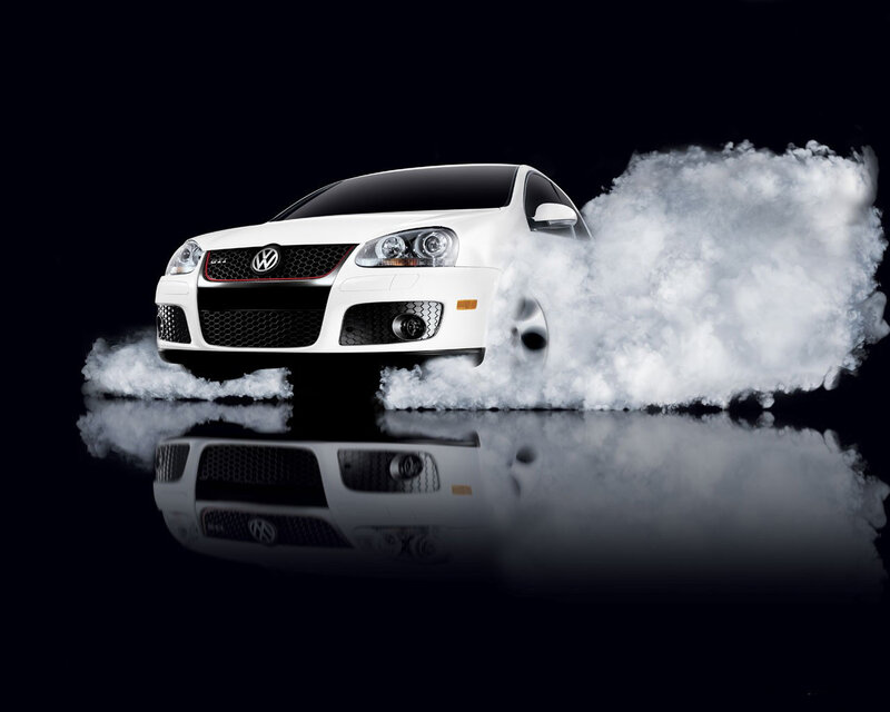 White Volkswagen GTI with smoke