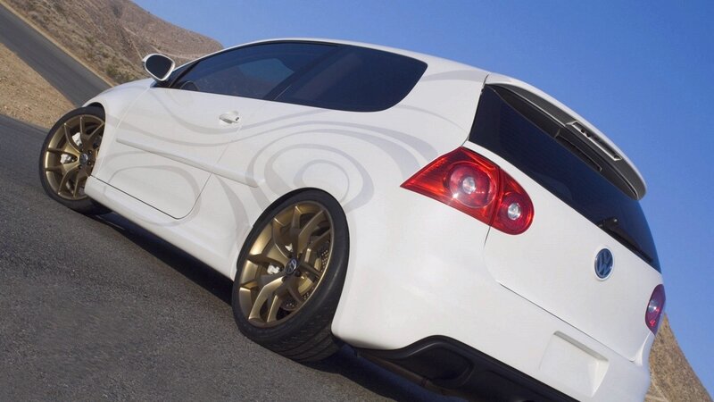 white volkswagen hatchback on road