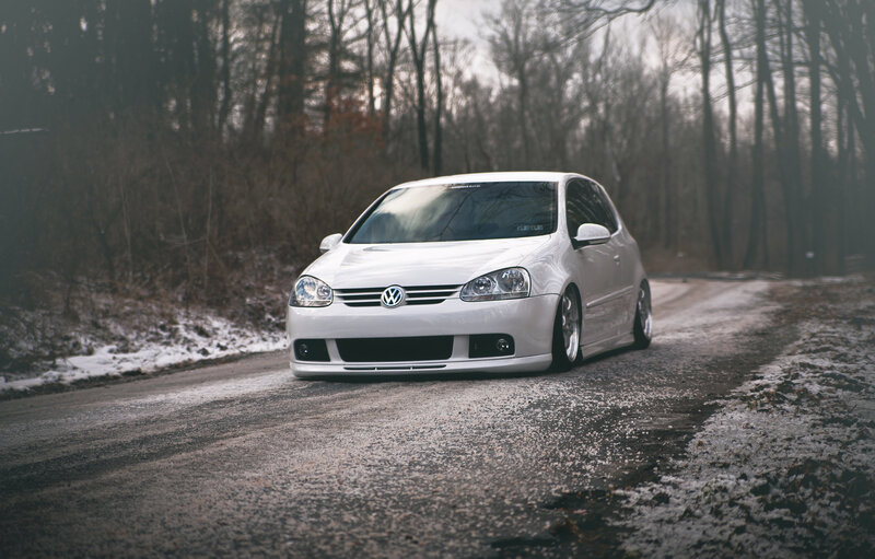 white volkswagen on snowy road