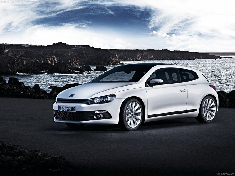 White Volkswagen Scirocco by the coast