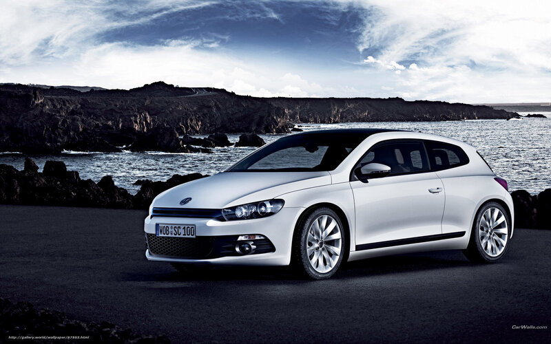 White Volkswagen Scirocco by the coast