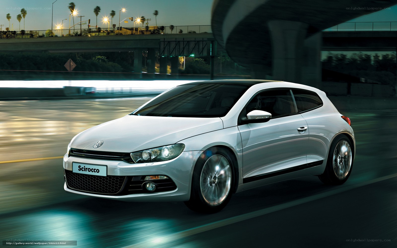 White Volkswagen Scirocco on city street