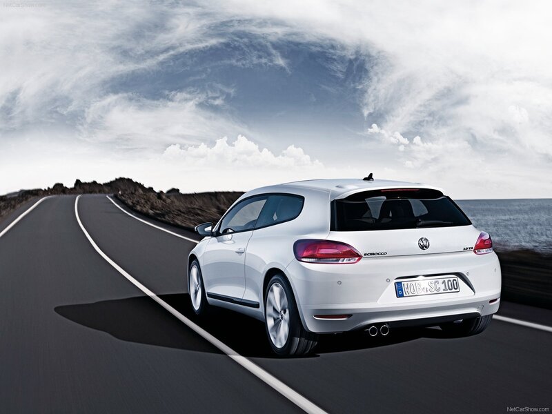 White Volkswagen Scirocco on coastal road