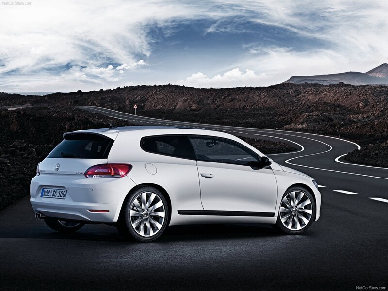 white volkswagen scirocco on winding road
