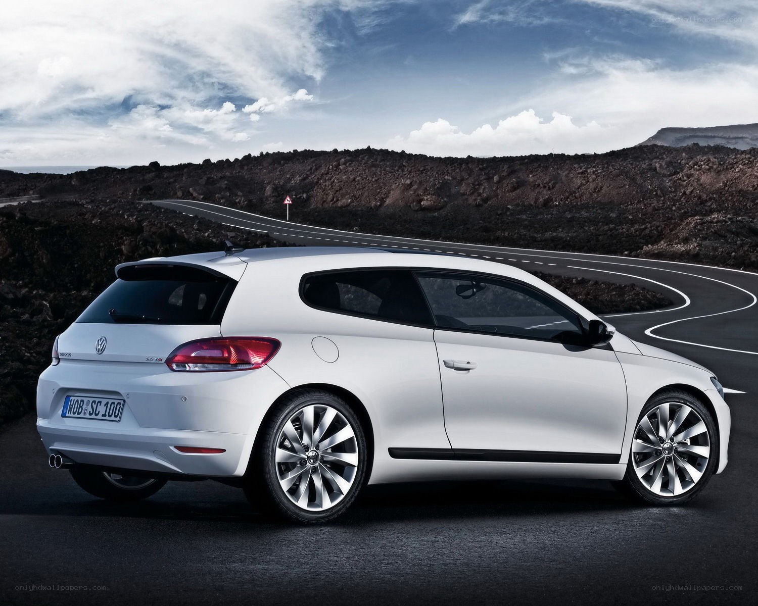 White Volkswagen Scirocco on winding road