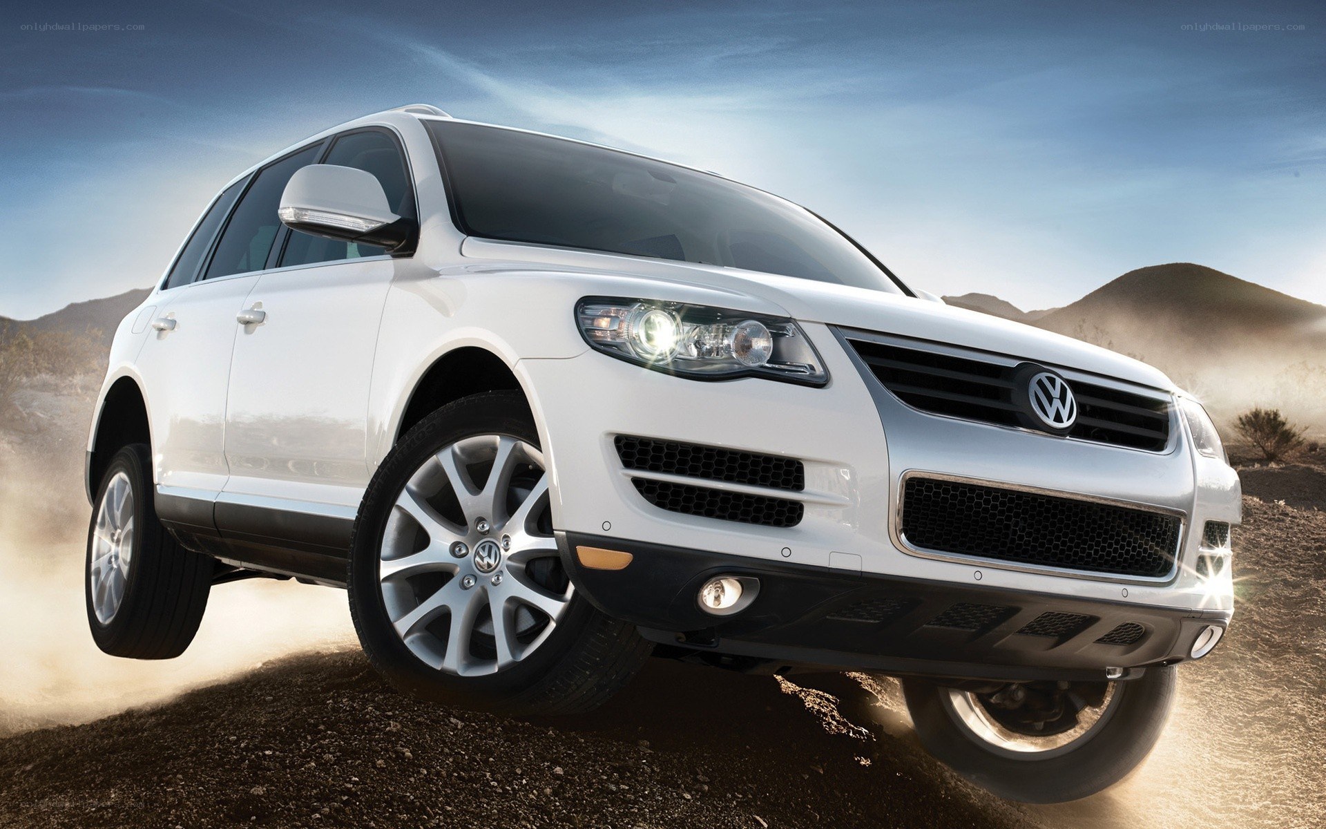 White Volkswagen SUV in desert