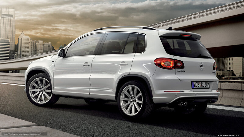 White Volkswagen Tiguan on city bridge
