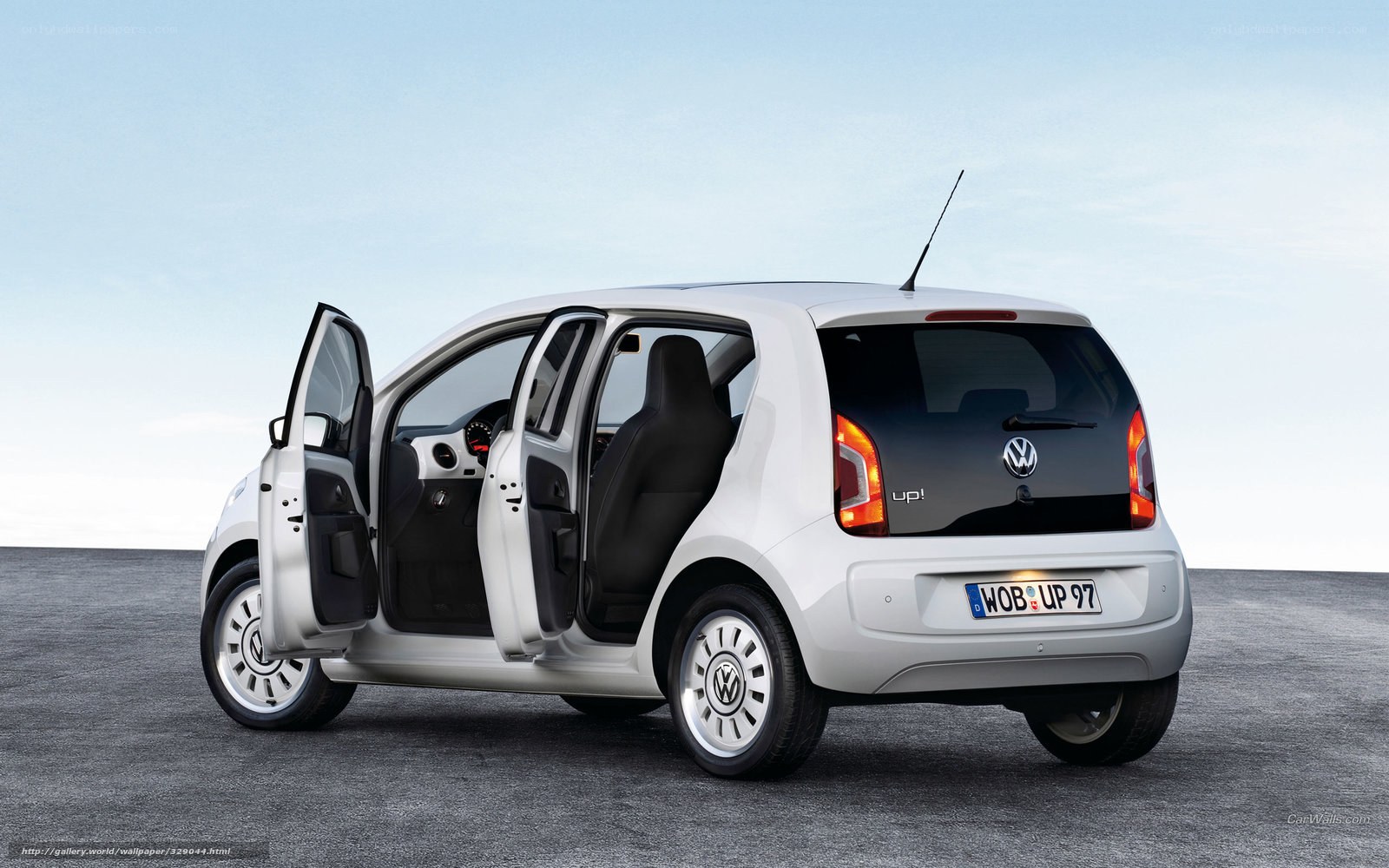 White Volkswagen Up! with open doors