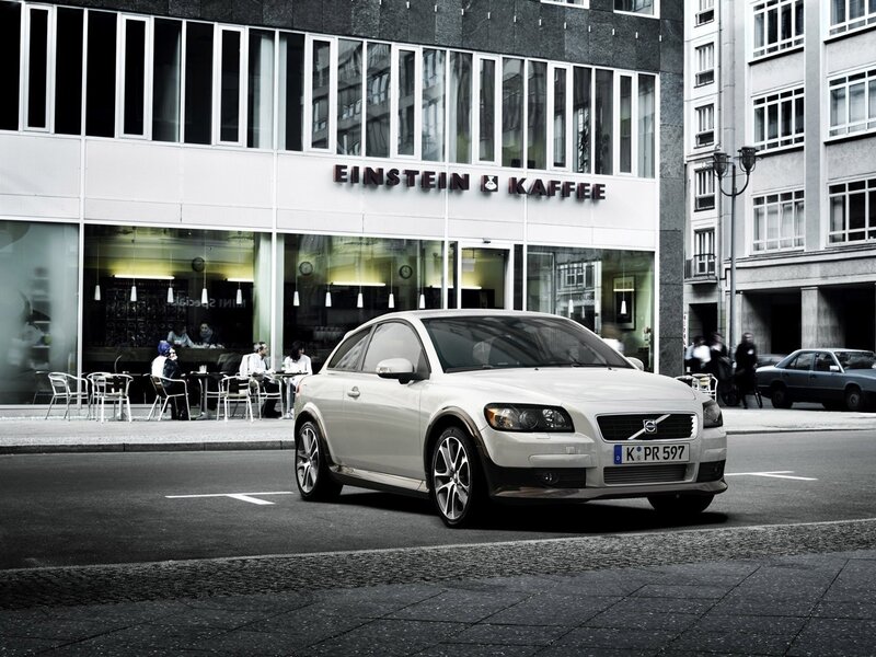 White Volvo C30 in city street