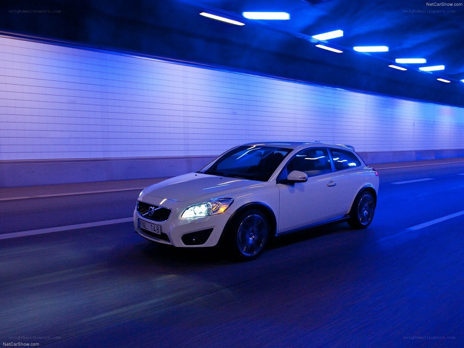 white volvo c30 in tunnel