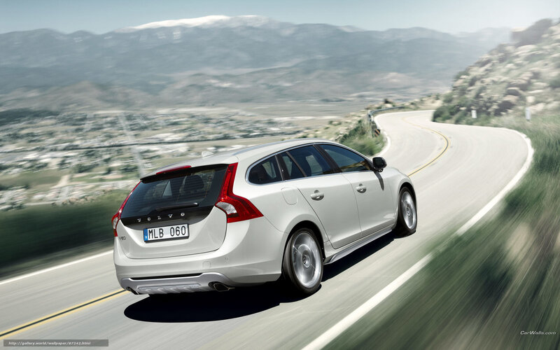 white volvo on winding road