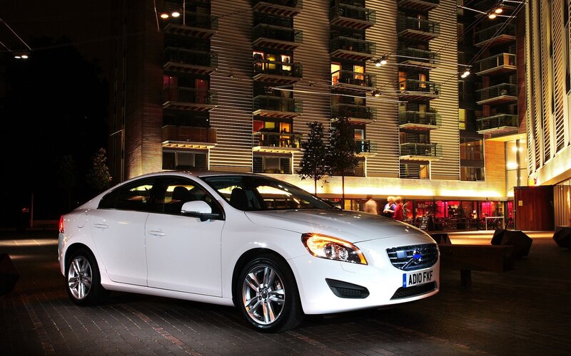 White Volvo parked at night