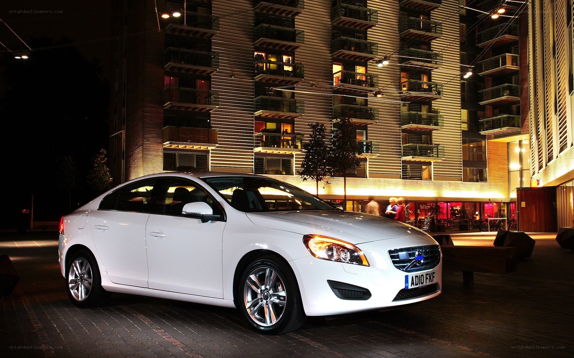White Volvo parked at night