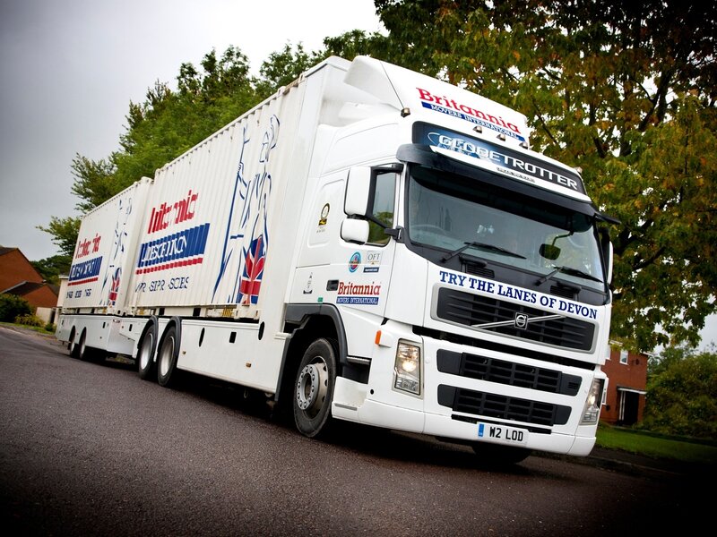 White Volvo truck on a road