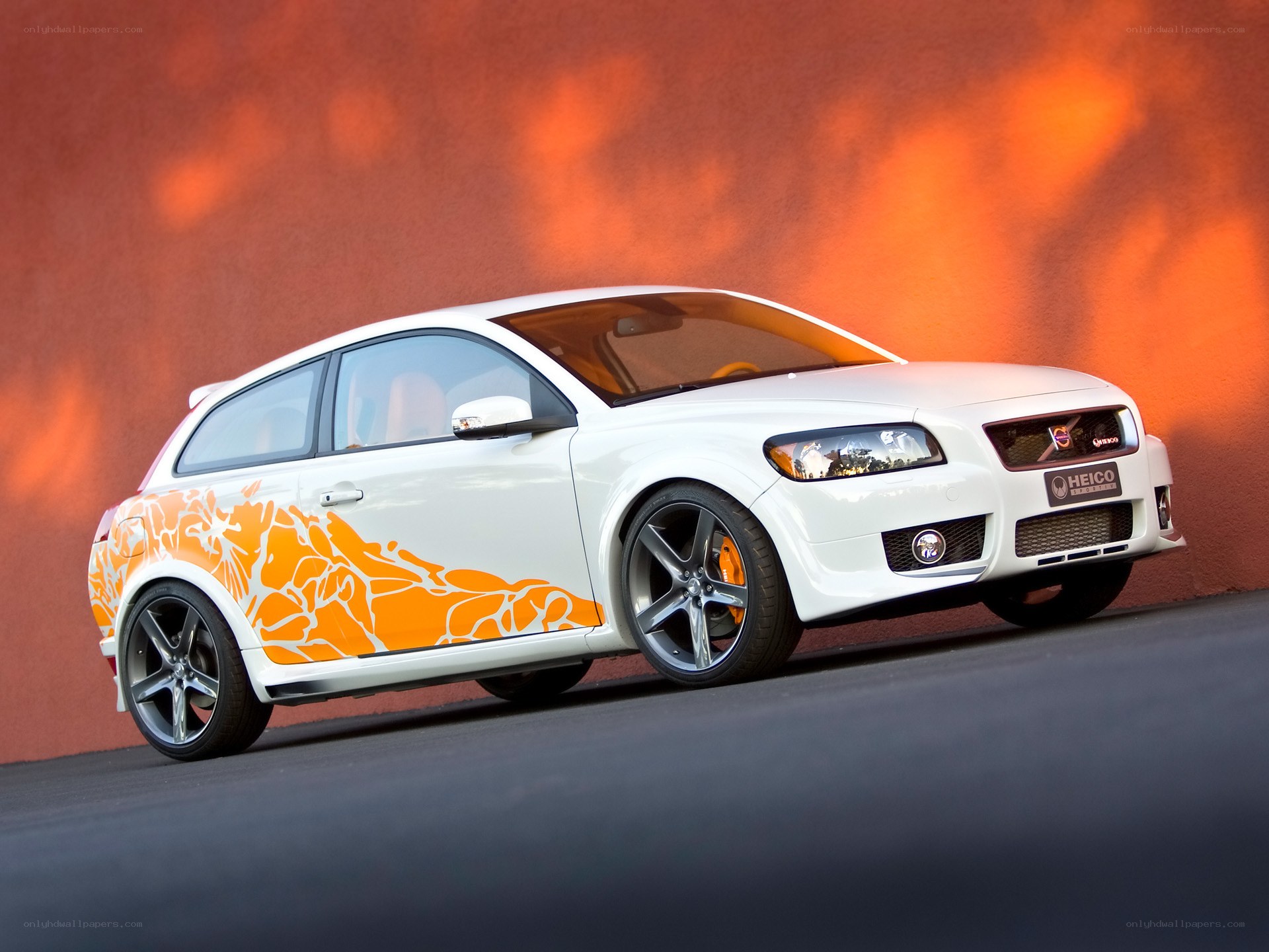 white volvo with orange graphics