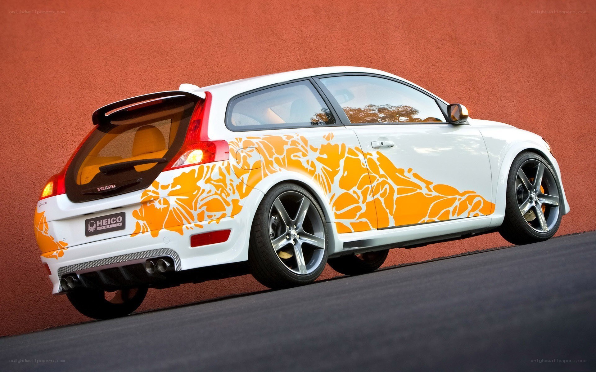 white volvo with orange graphics