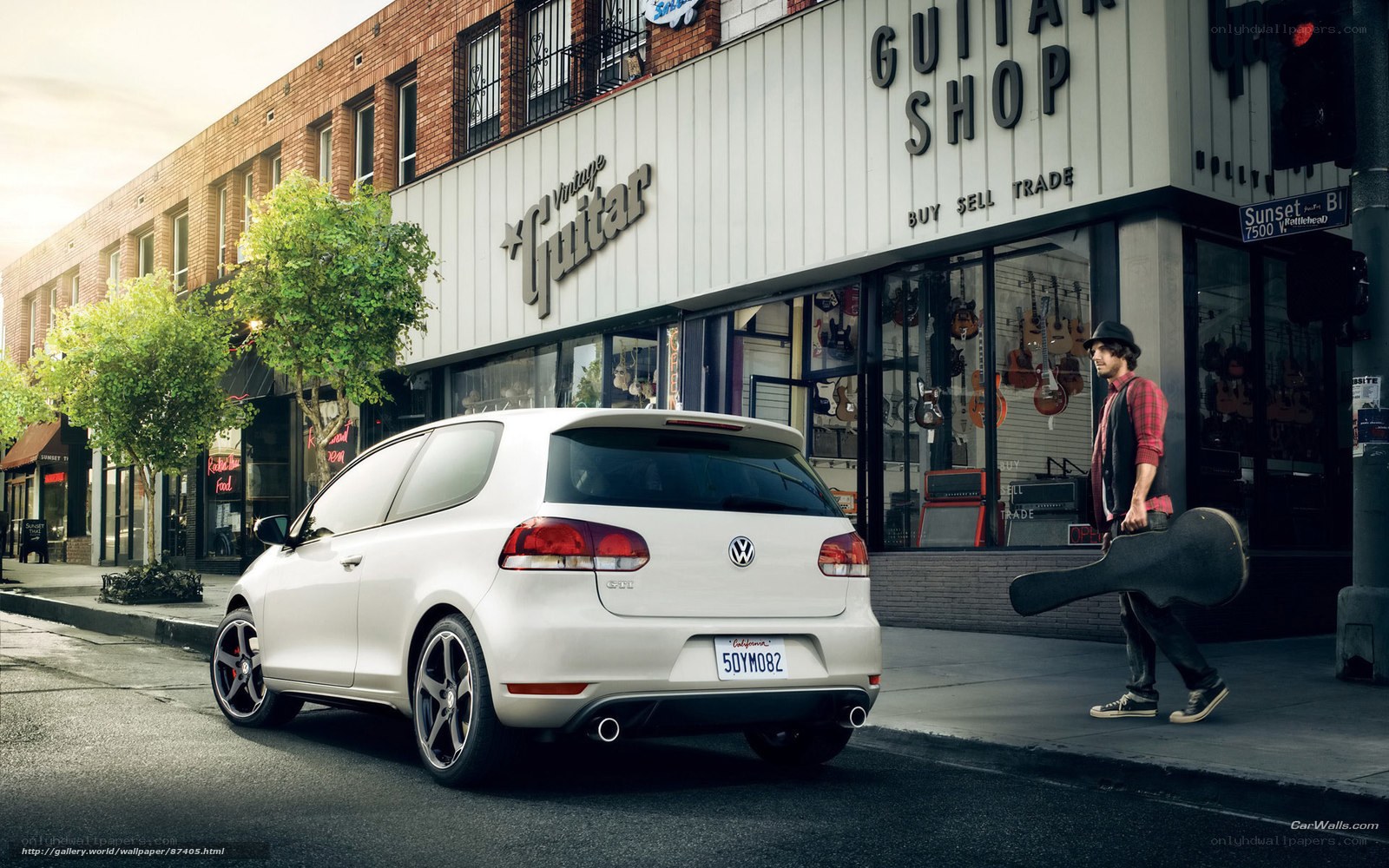 White VW Golf GTI on city street