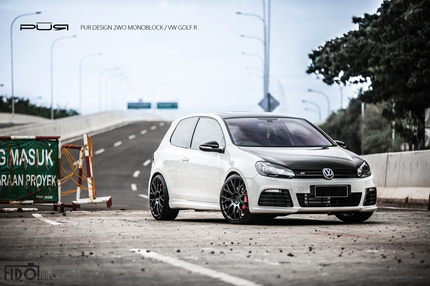White VW Golf R on highway
