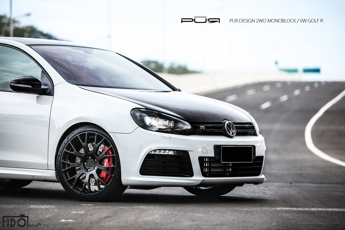 White VW Golf R with custom wheels