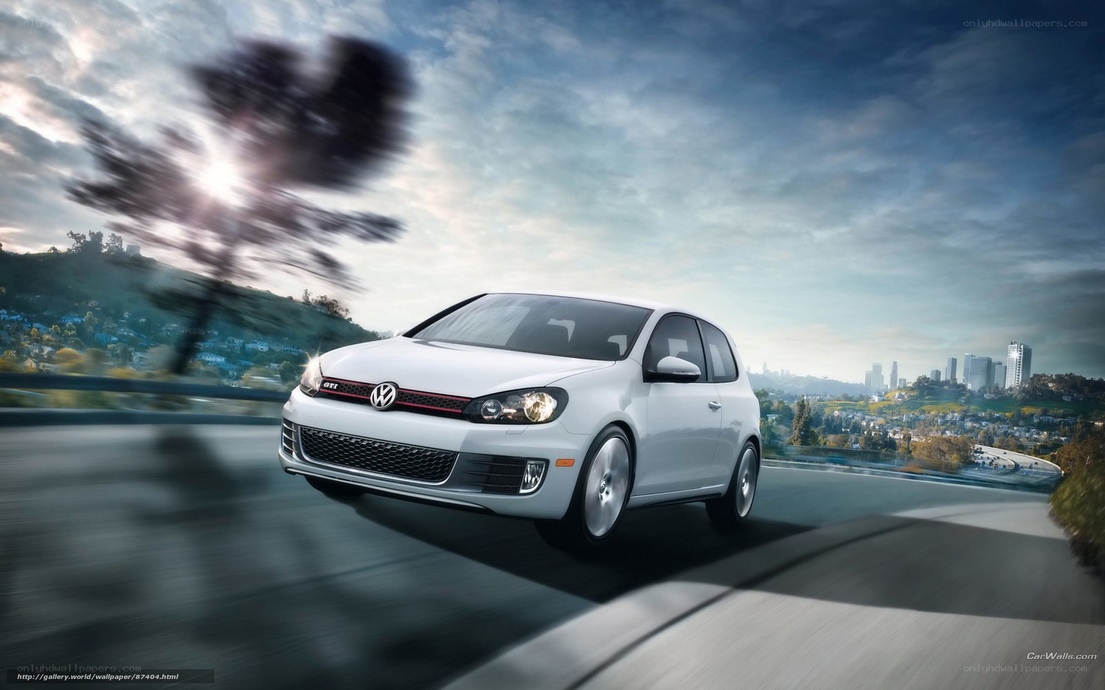 White VW GTI on a winding road