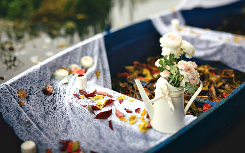 White Watering Can with Flowers
