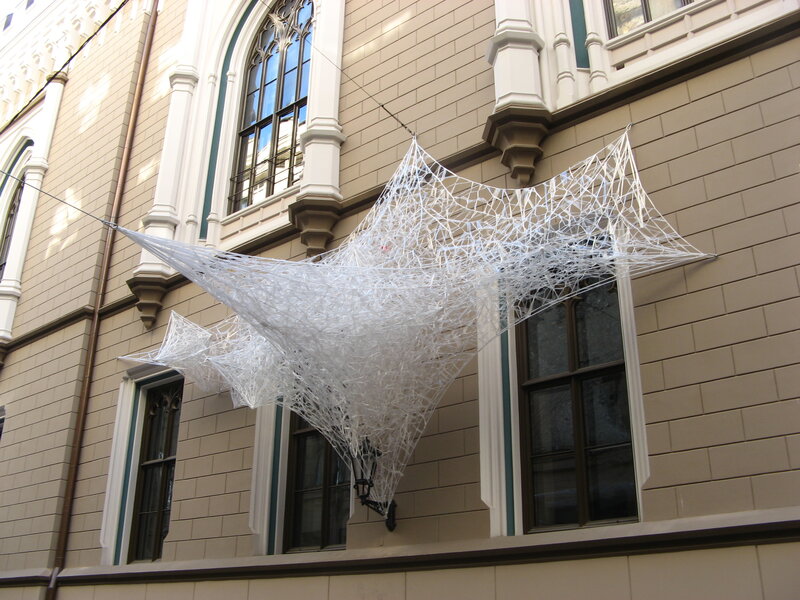 White web sculpture on building