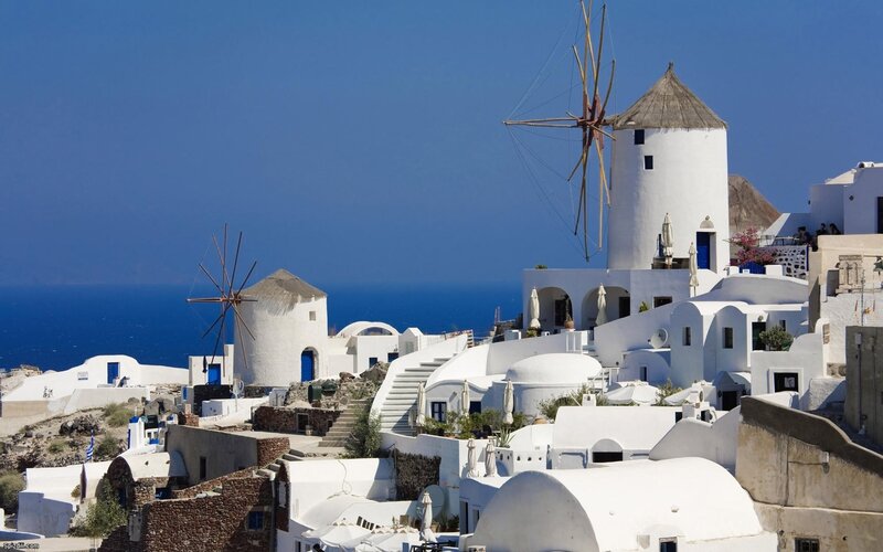White windmills on Greek island
