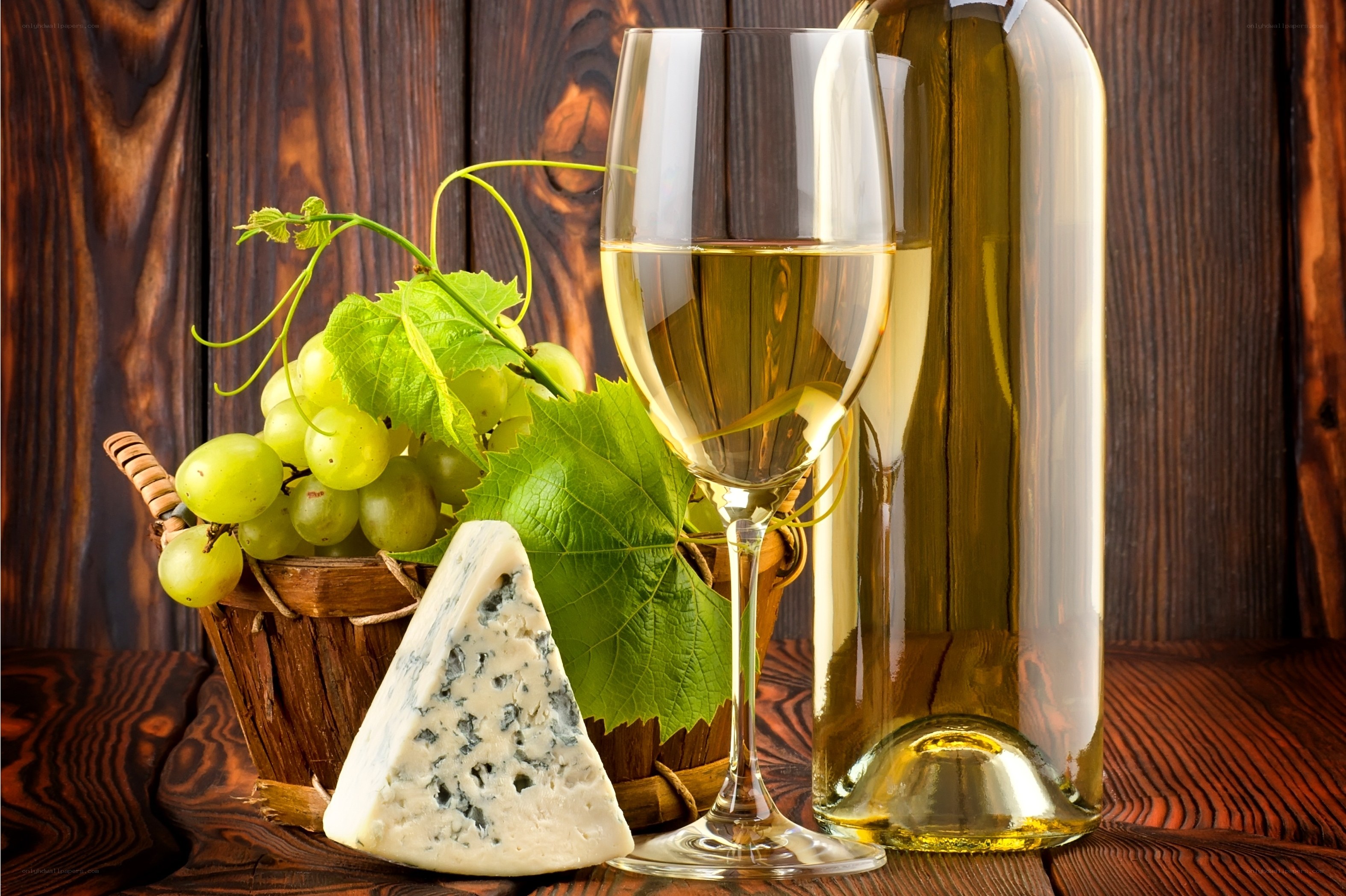 White wine and cheese with grapes