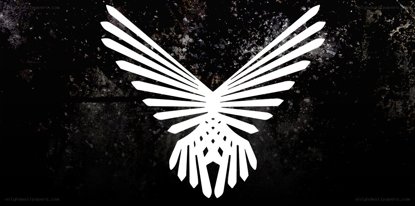 white winged symbol on dark background