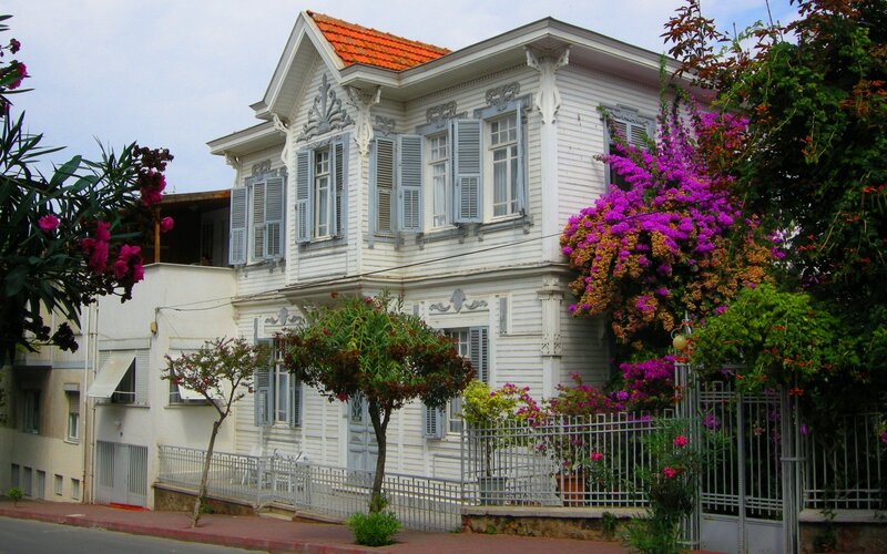 White wooden house with flowers
