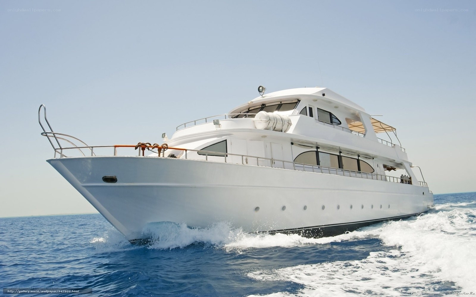 White yacht sailing on blue sea