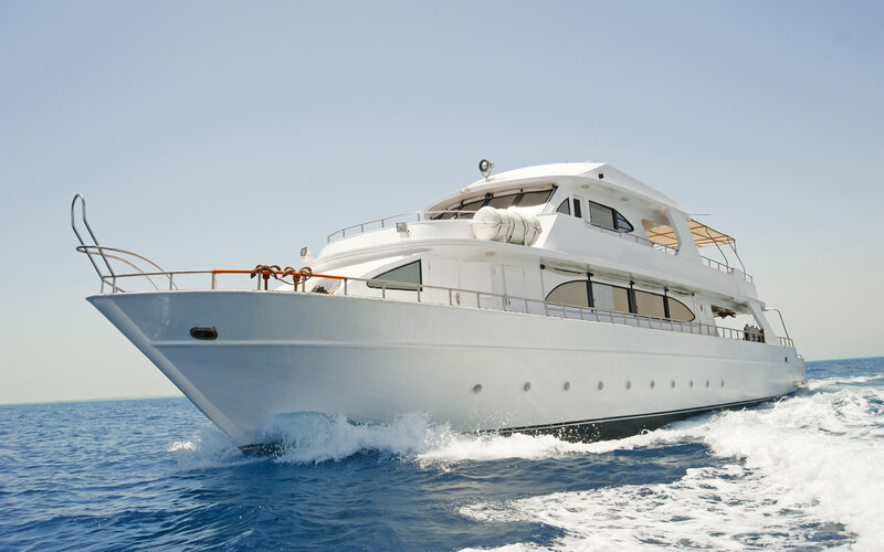White yacht sailing on blue sea