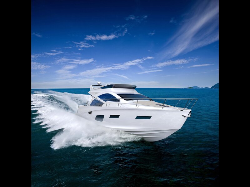White yacht speeding on blue sea