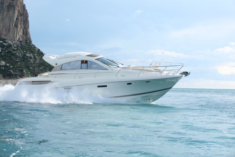White yacht speeding on the sea