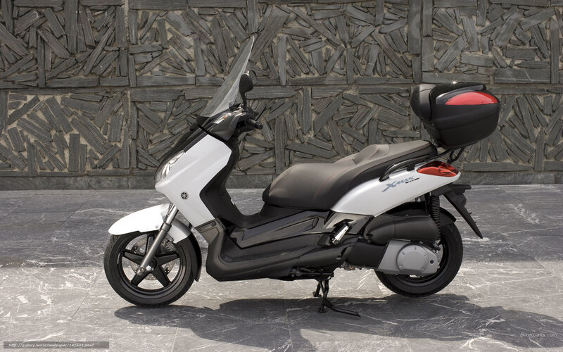White Yamaha scooter with storage