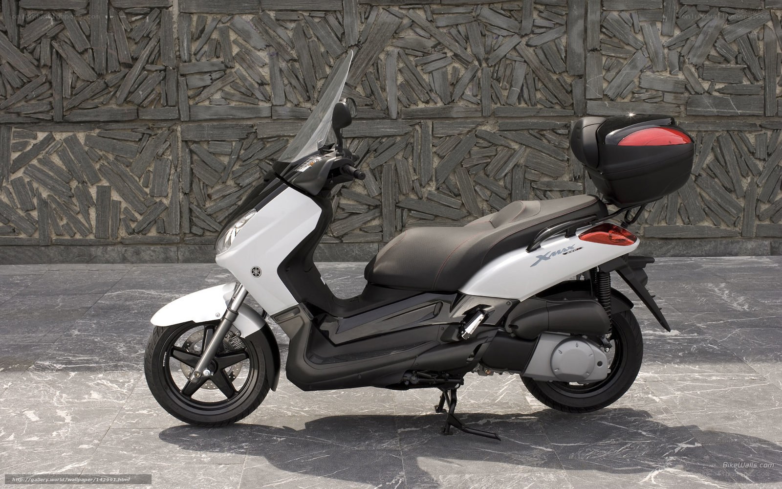 White Yamaha scooter with storage
