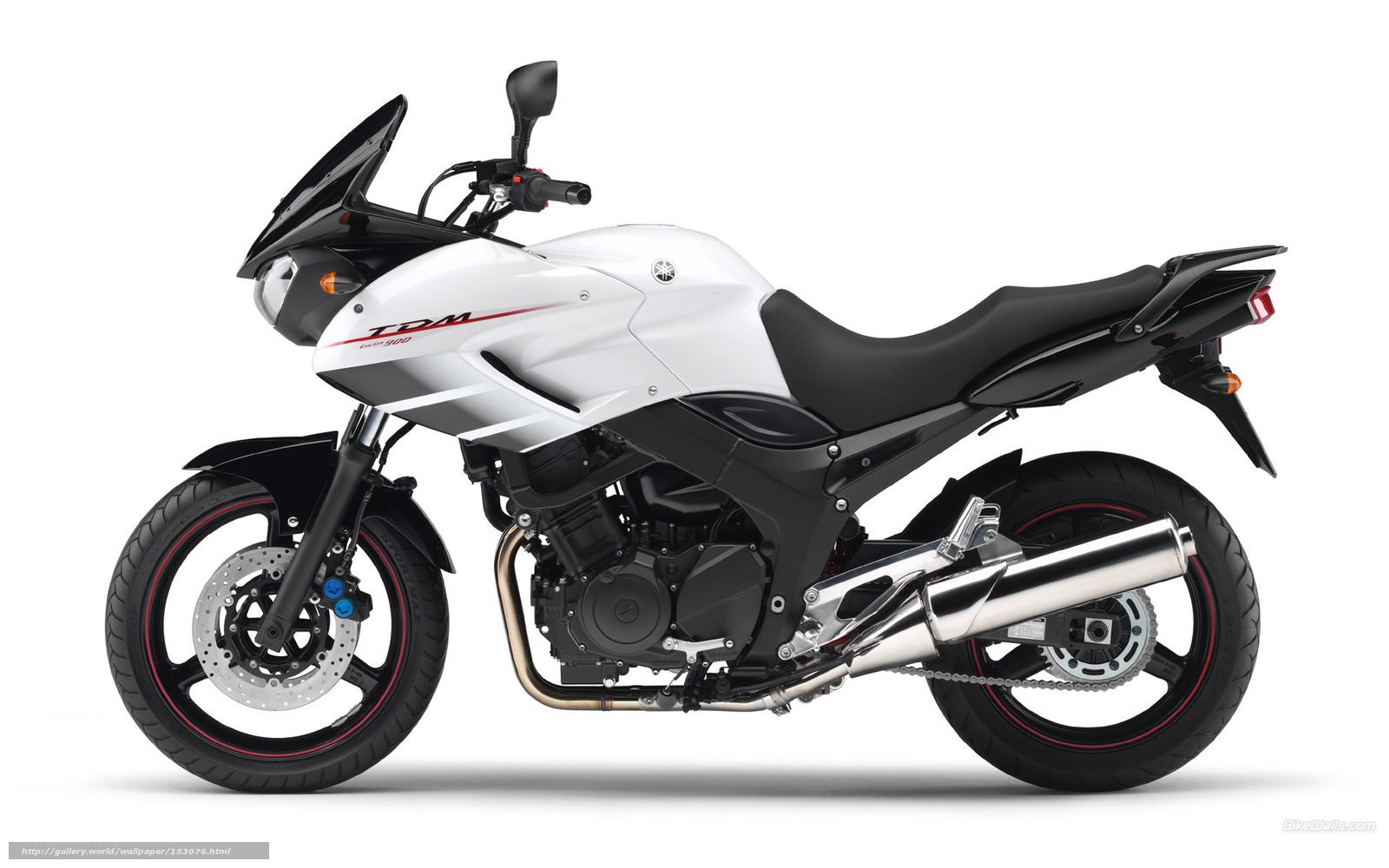 white Yamaha TDM motorcycle