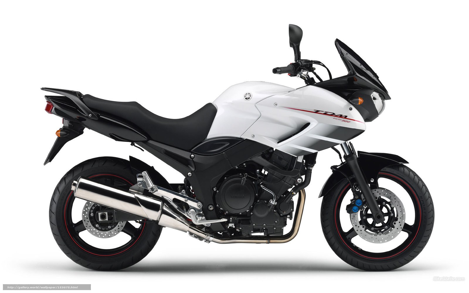 white Yamaha TDM motorcycle
