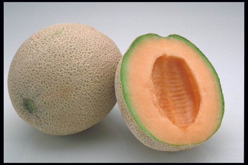 whole and halved cantaloupe melon