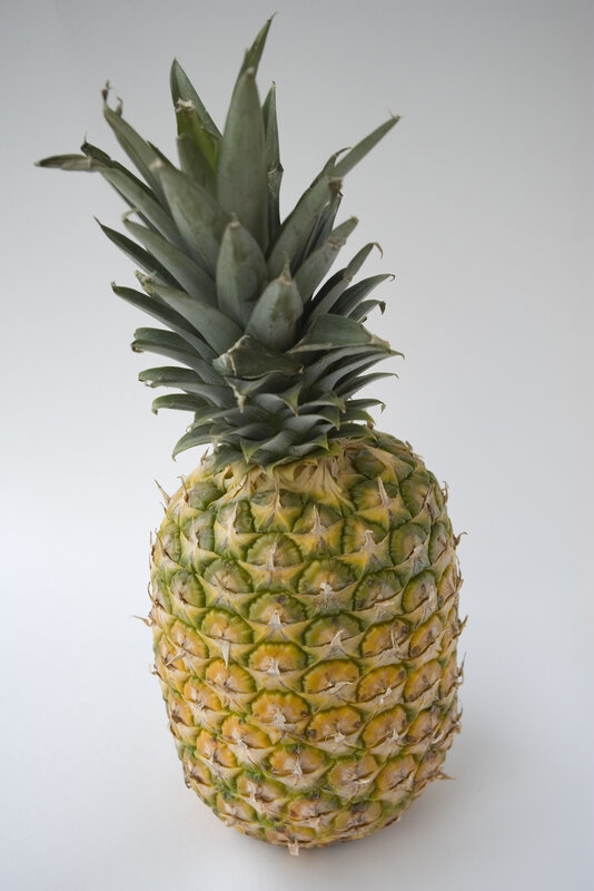 whole pineapple on white background