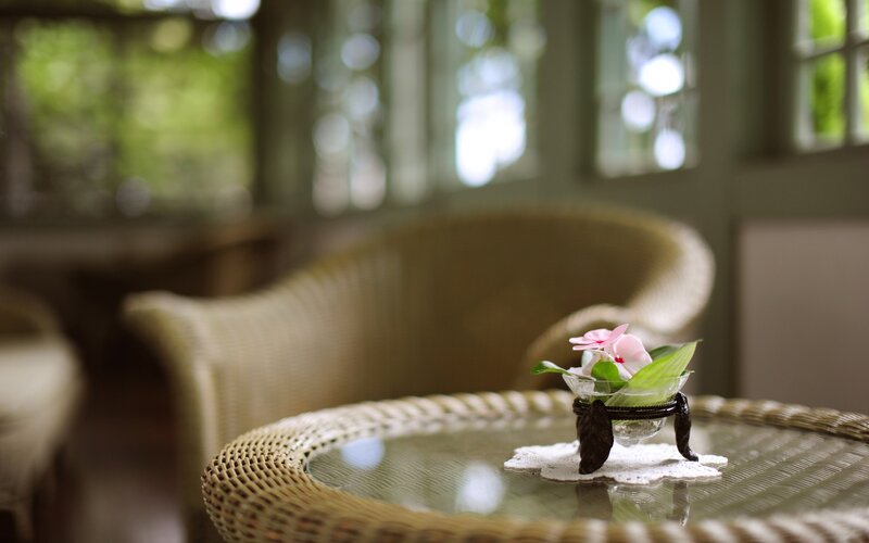 Wicker table with flower arrangement