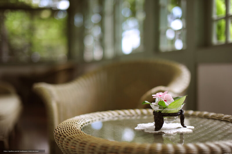 Wicker table with flower arrangement