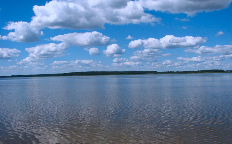 Wide River under Cloudy Sky