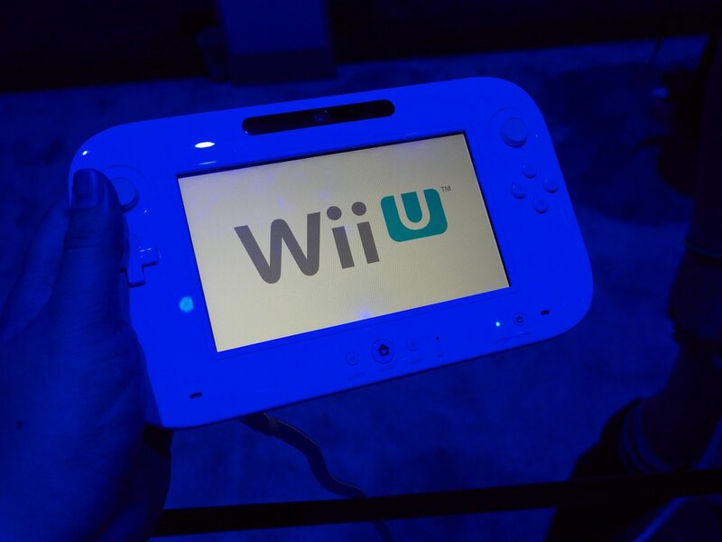 Wii U console in hand