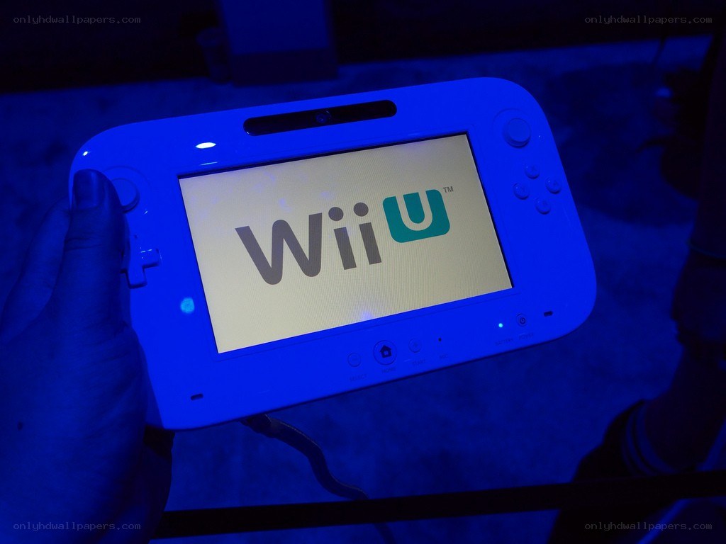 Wii U console in hand