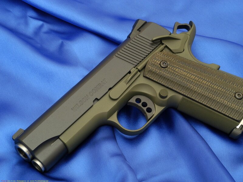 Wilson Combat pistol on blue cloth