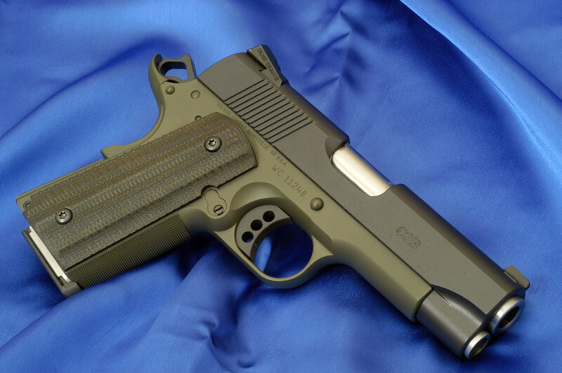Wilson Combat pistol on blue fabric