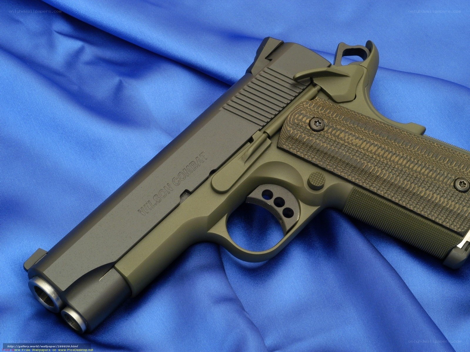 Wilson Combat pistol on blue fabric