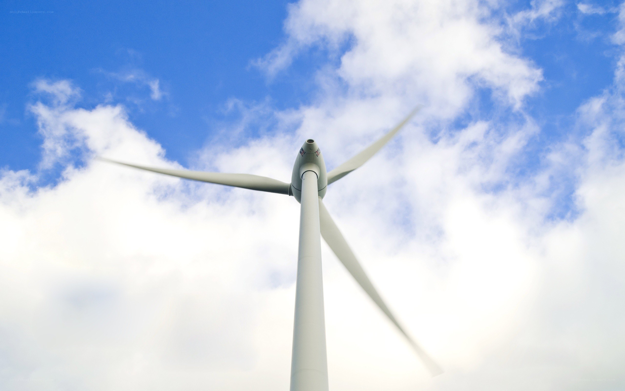 Wind turbine against blue sky